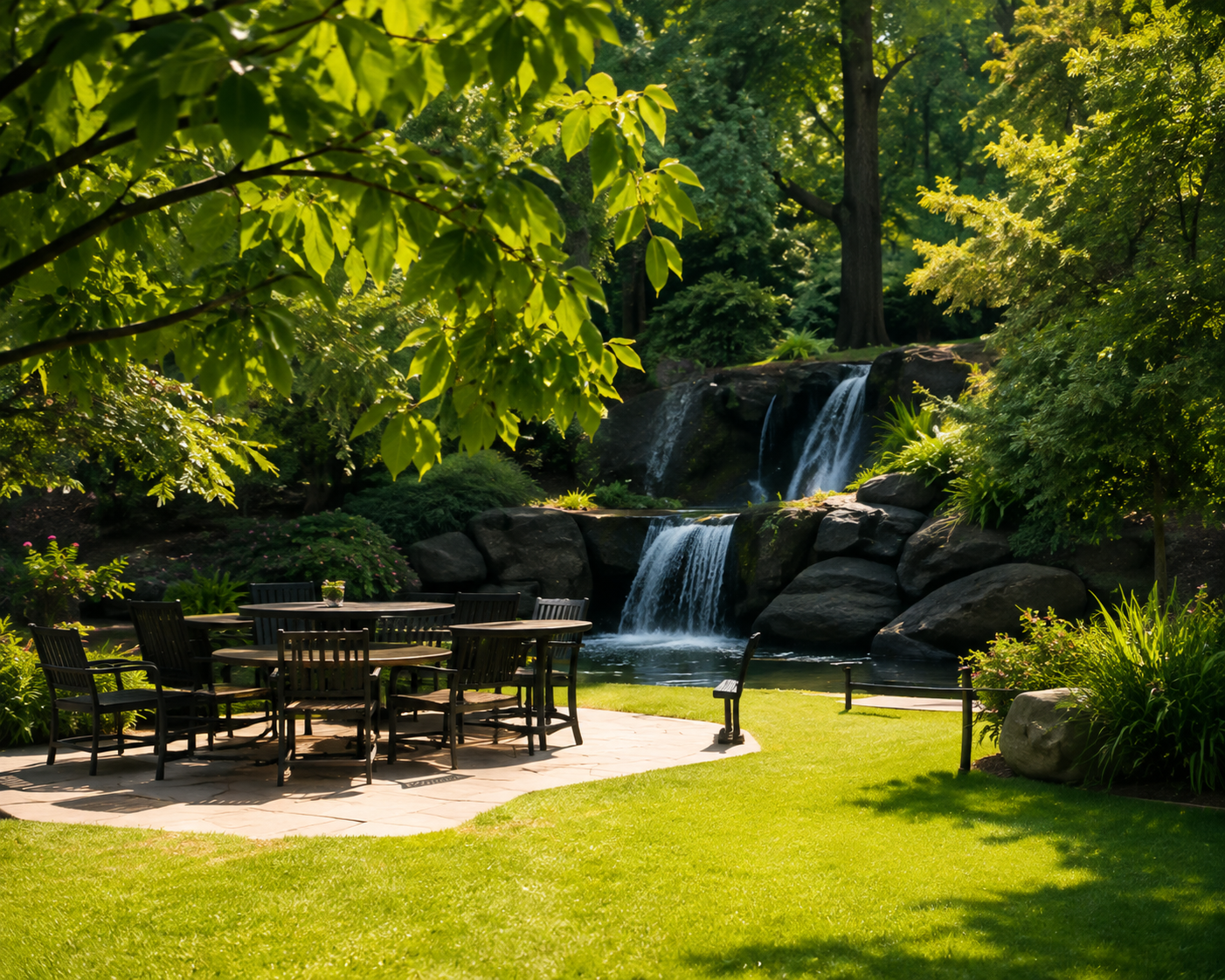 Park patio and waterfall surrounded by trees